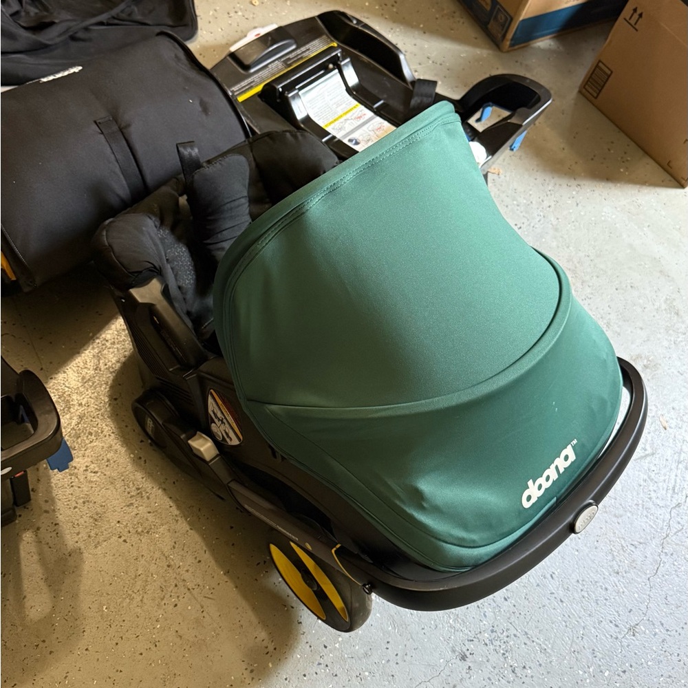 Doona Infant Car Seat + Twin Bases in Green and Black - Picture 6 of 10